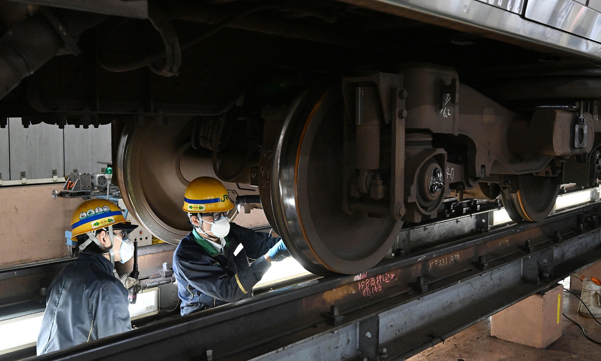 A specified skilled worker, right, inspects a train car at JR East's Tokyo General Rolling Stock Center in Shinagawa Ward, Tokyo, Japan, on April 14, 2026. Photo: VCG