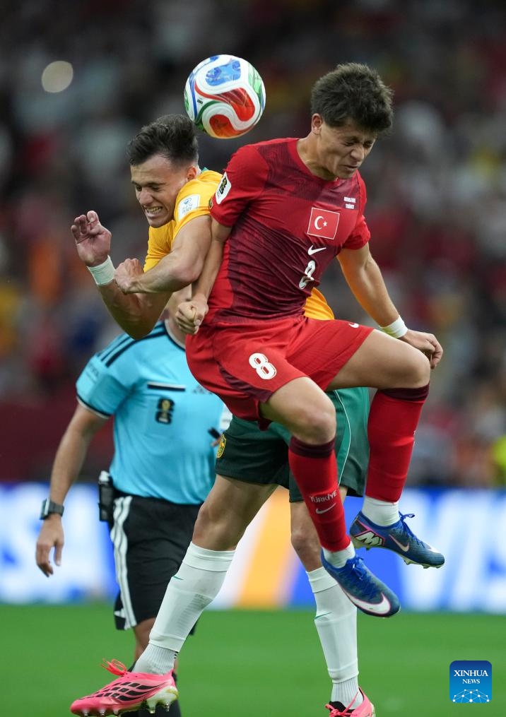 Paul Okon-Engstler (L) of Australia vies with Arda Guler of Türkiye during the group D match between Australia and Türkiye at the 2026 FIFA World Cup at BC Place Vancouver in Vancouver, Canada, June 13, 2026. (Xinhua/Meng Yongmin)