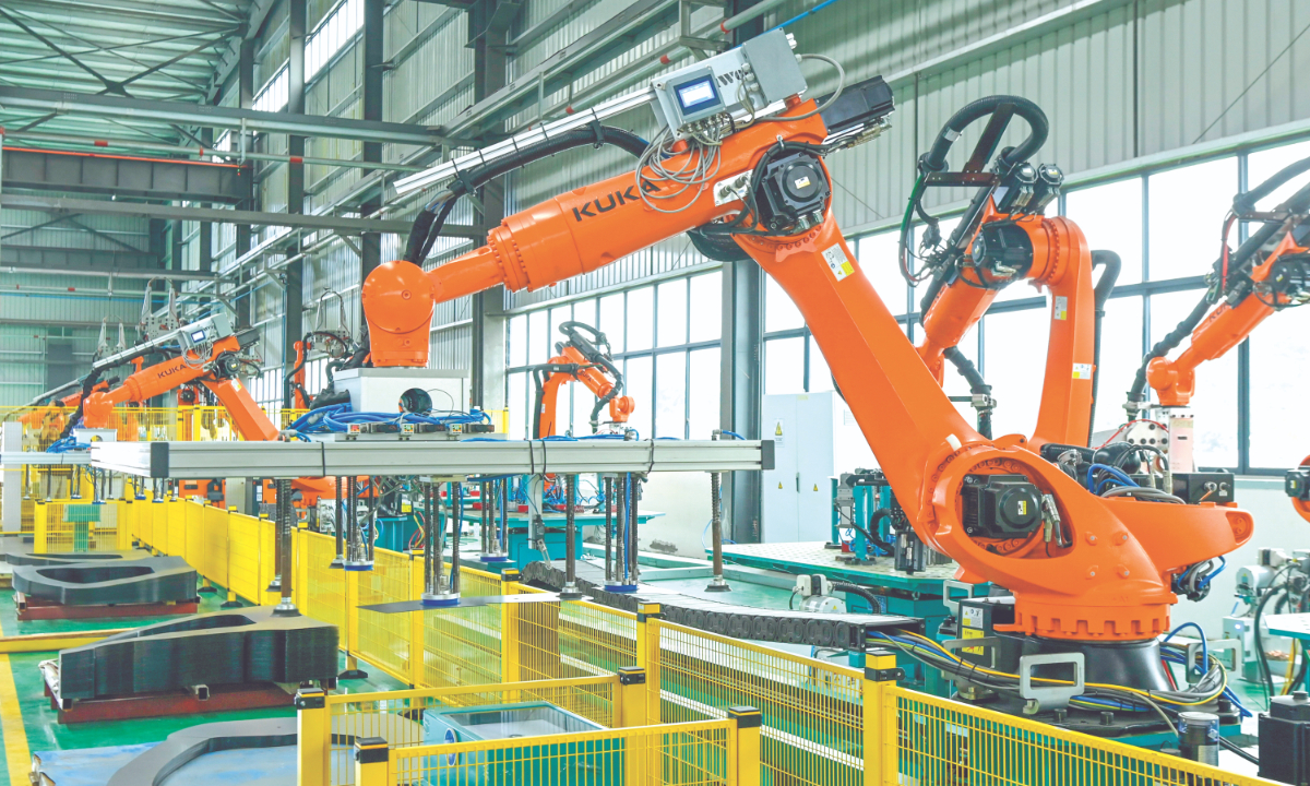 Robotic arms operate at an auto parts factory in Southwest China's Chongqing Municipality, on June 5, 2026. Photo: VCG