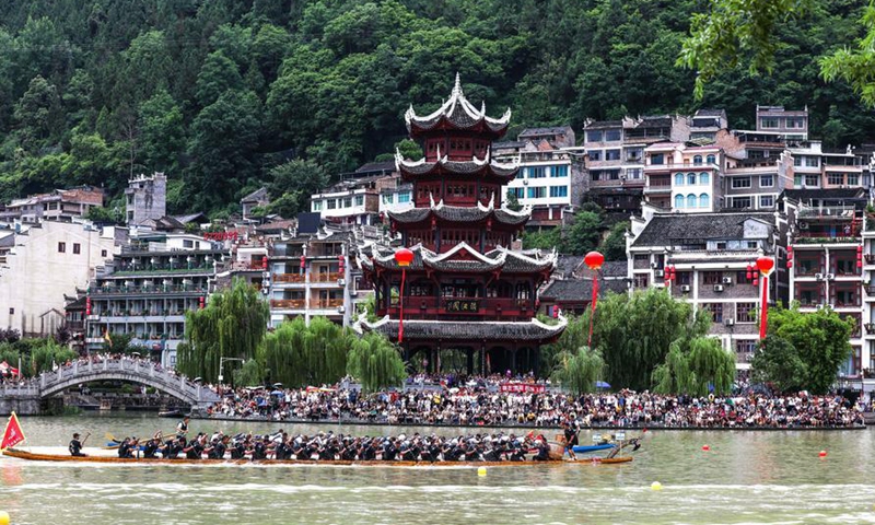 Dragon boat teams compete at a race during Dragon Boat Festival celebrations at Zhenyuan ancient city in Zhenyuan County, Qiandongnan Miao and Dong Autonomous Prefecture, southwest China's Guizhou Province, on June 19, 2026. People across China are celebrating the Dragon Boat Festival, also known as the Duanwu Festival, which falls on June 19 this year.  (Xinhua/Yang Wenbin)