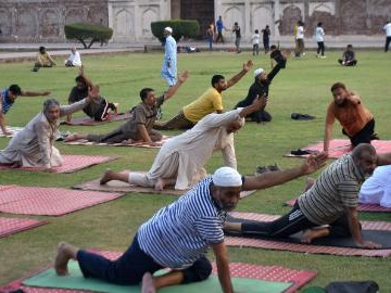 People perform yoga ahead of International Day of Yoga in Pakistan