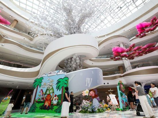 People shop in Haikou during Dragon Boat Festival holiday