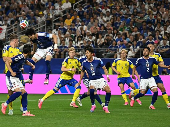 Japan, Australia keep Asia's World Cup hopes alive