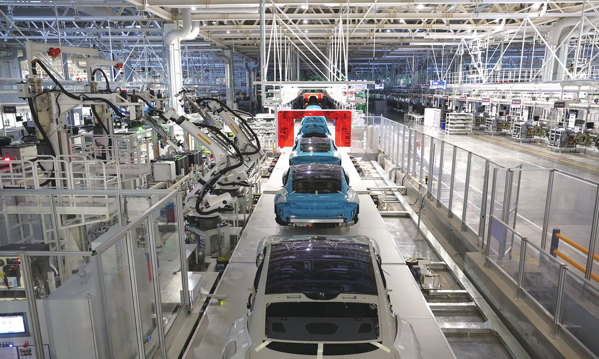 Vehicles move through the automated assembly process at Xiaomi’s final assembly workshop. Photo: Courtesy of Xiaomi