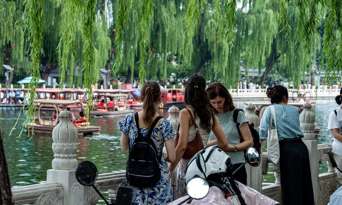 Foreign tourists visit Beijing's Shichahai lake on July 4. Photo: VCG