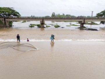 Fishermen rely on traditional cast nets to catch fish in Savannakhet, Laos
