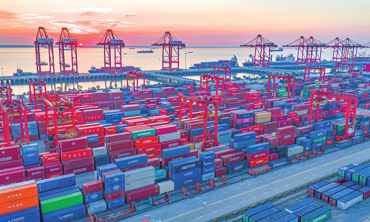 Gantry cranes stand in rows at the Taicang port area of Suzhou Port in East China's Jiangsu Province, on June 10, where cargo vessels load and unload in an orderly manner at berths. The port saw steady growth in container and cargo throughput in the first five months of the year. Photo: VCG