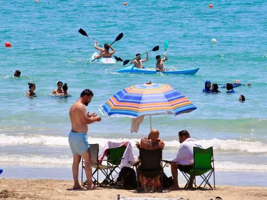 People enjoy themselves on beach in Tyre, Lebanon