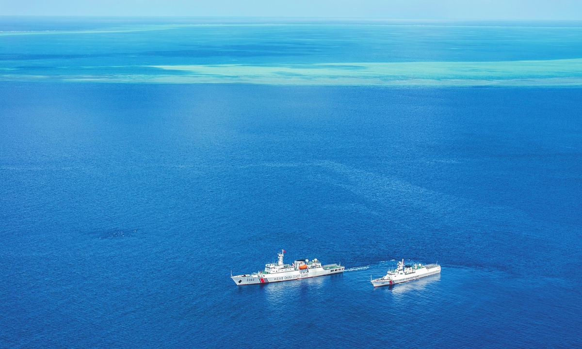 China Coast Guard vessels patrol the waters near China's Huangyan Dao in the South China Sea on July 8, 2026 (drone photo). Photo: Xinhua