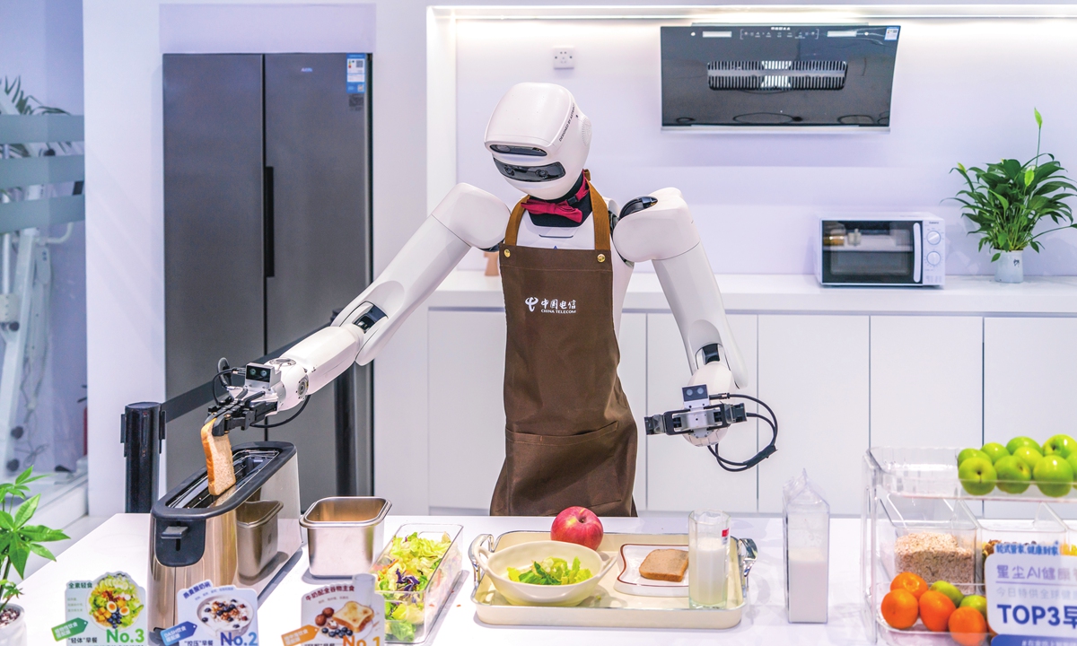 A humanoid robot demonstrates a toast-making service at the 2025 Digital Intelligence Technology Ecosystem Conference in Guangzhou, South China’s Guangdong Province, on December 5, 2025. Photo: VCG