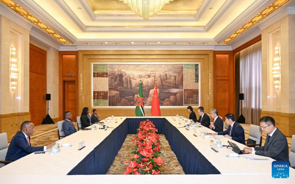 Chinese Foreign Minister Wang Yi, also a member of the Political Bureau of the Communist Party of China Central Committee, meets with Vince Henderson, foreign minister of the Commonwealth of Dominica, who is in China to attend the World Artificial Intelligence Conference, in Shanghai, east China, July 18, 2026. (Xinhua/Chen Haoming)