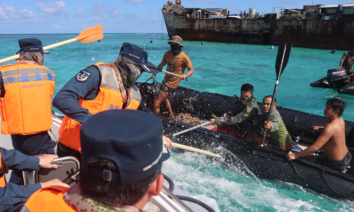 Philippine military personnel deliberately provoke CCG law enforcement officers. Photo: courtesy of CCG