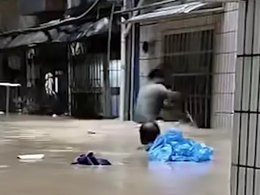 Young official breaks window to save trapped woman