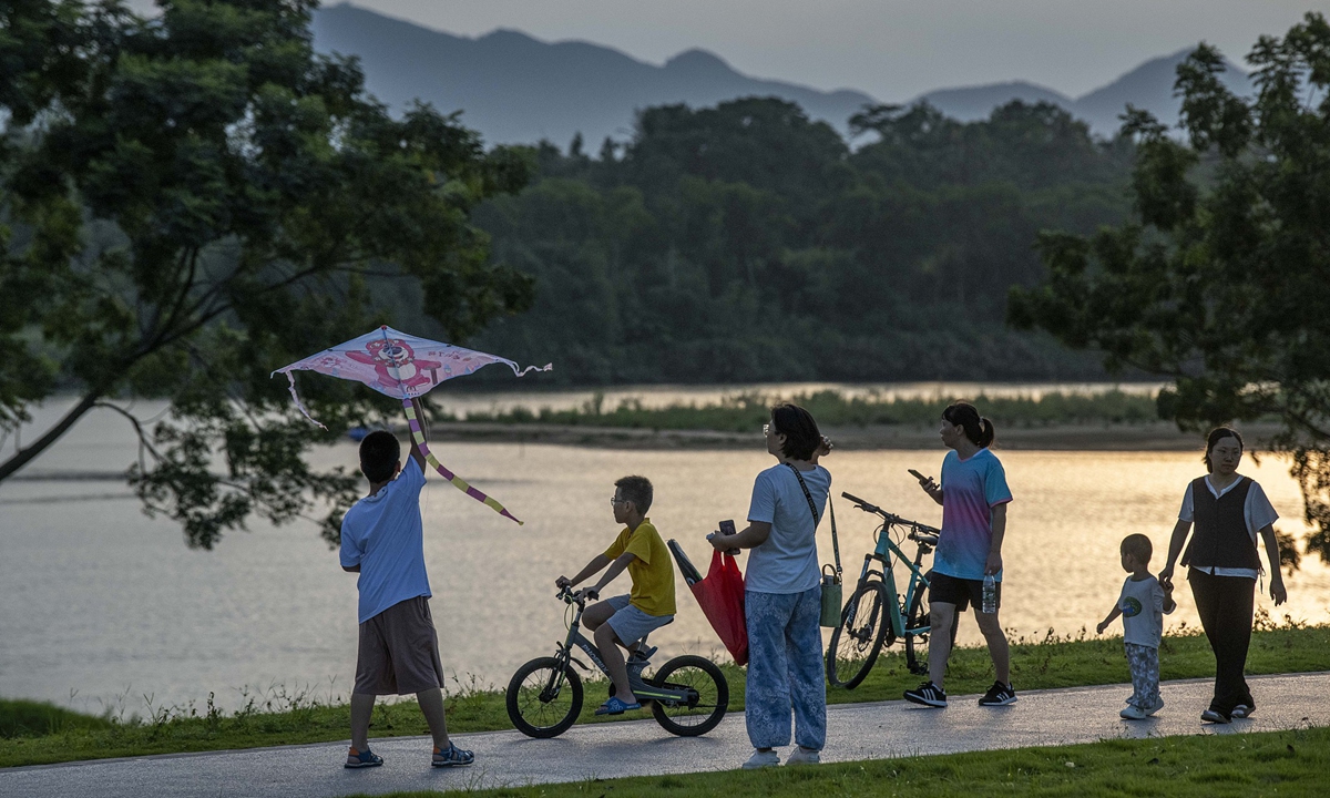 Residents enjoy leisure activities at a sports park transformed from a sand pit left behind by years of unregulated mining in Qionghai, South China's Hainan Province, on August 12, 2026. Photo: VCG