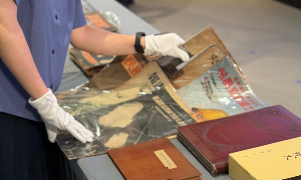 A staff member arranges archival materials documenting Japan’s invasion of China brought back from Japan by Marcus Detrez and others at the Memorial Hall of the Victims in Nanjing Massacre by Japanese Invaders in Nanjing, East China’s Jiangsu Province, on August 15, 2026. Photo: Shen Sheng/GT