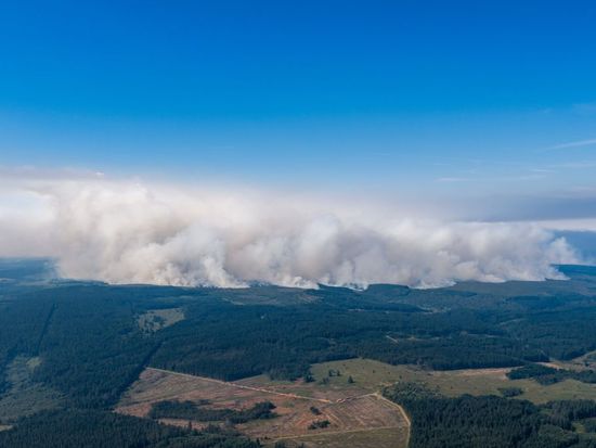 Firefighters battle a massive Belgian wildfire that forced hundreds to evacuate