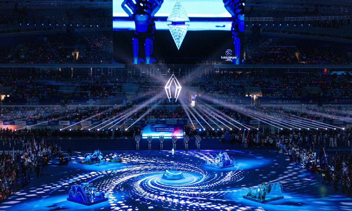 The “Zhixin,” or intelligence chip — WHRG’s equivalent to the Olympic flame — lits up above the “Ice Ribbon” on August 22, 2026. Photo:Li Hao/GT