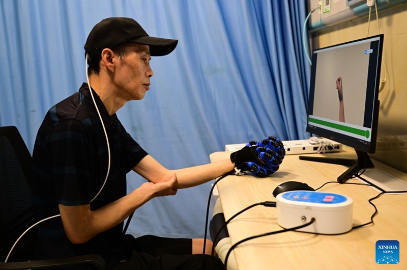 A patient, who received Anhui's first semi-invasive brain-computer interface (BCI) surgery in April 2026, undergoes rehabilitation training at a hospital in Bengbu, east China's Anhui Province, July 17, 2026. Bengbu, a traditional industrial city, has stepped up the development of its brain-computer interface (BCI) industry in recent years. By strengthening collaboration among industry, research institutes and medical institutions, Bengbu has built an innovation ecosystem that supports both BCI research and clinical application, aiming to become an emerging BCI innovation hub in the Yangtze River Delta region. Photo: Xinhua