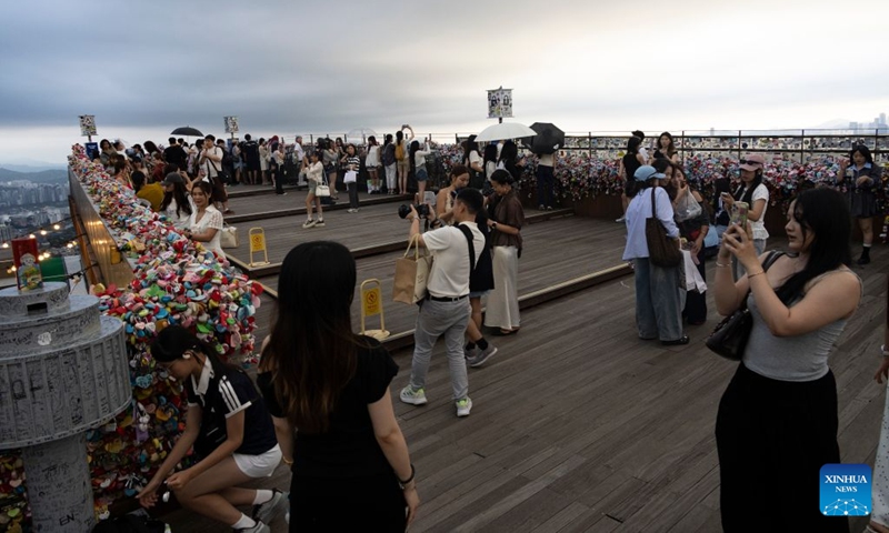 Tourists are seen around the Namsan Seoul Tower in Seoul, South Korea, July, 18, 2026. (Photo by Jun Hyosang/Xinhua)