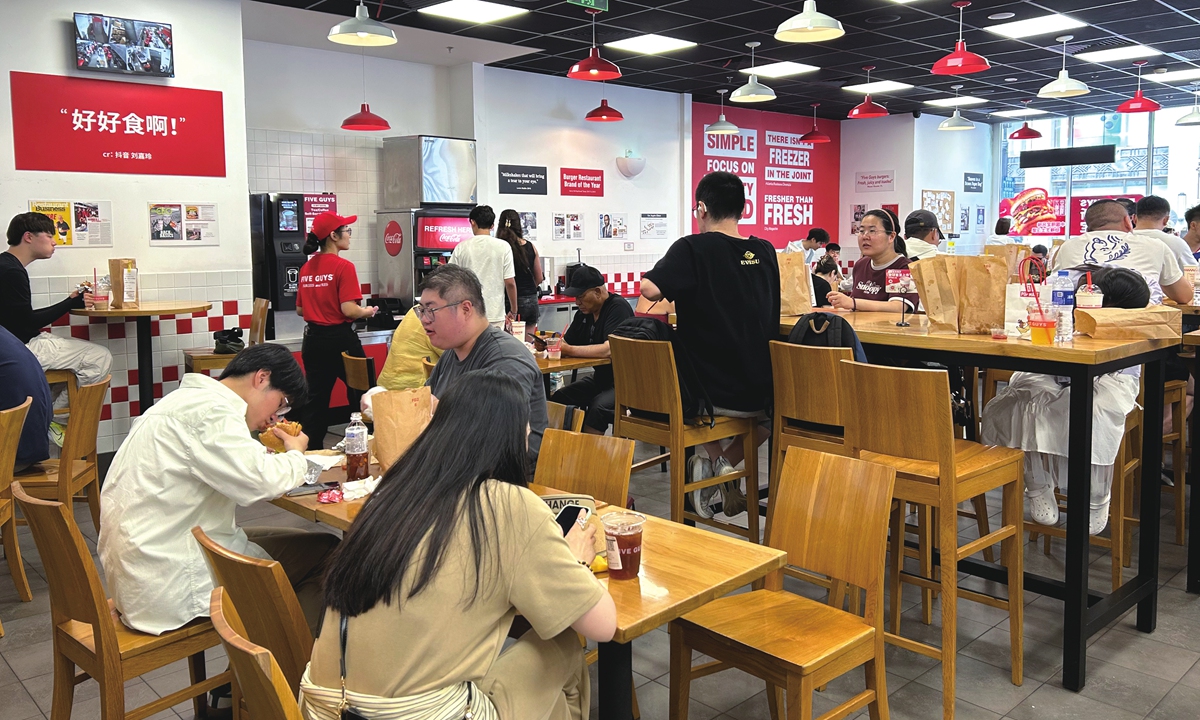 Customers dine at a Five Guys restaurant in a shopping mall in Shanghai on July 14, 2026. Photo: Qi Xijia/GT