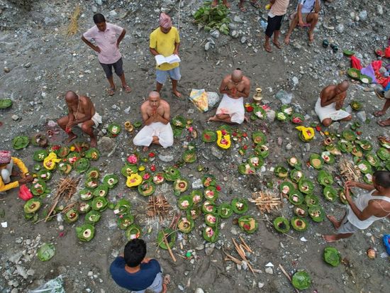 Symbolic funerals held in Nepal for those feared lost as some missing tourists make contact