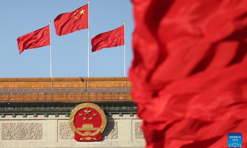 This photo taken on Oct. 16, 2022 shows flags on the Tian'anmen Square and atop the Great Hall of the People in Beijing, capital of China. (Xinhua/Li Ming)