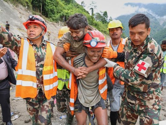 2 trapped workers rescued from a hydropower tunnel 9 days after Nepal floods