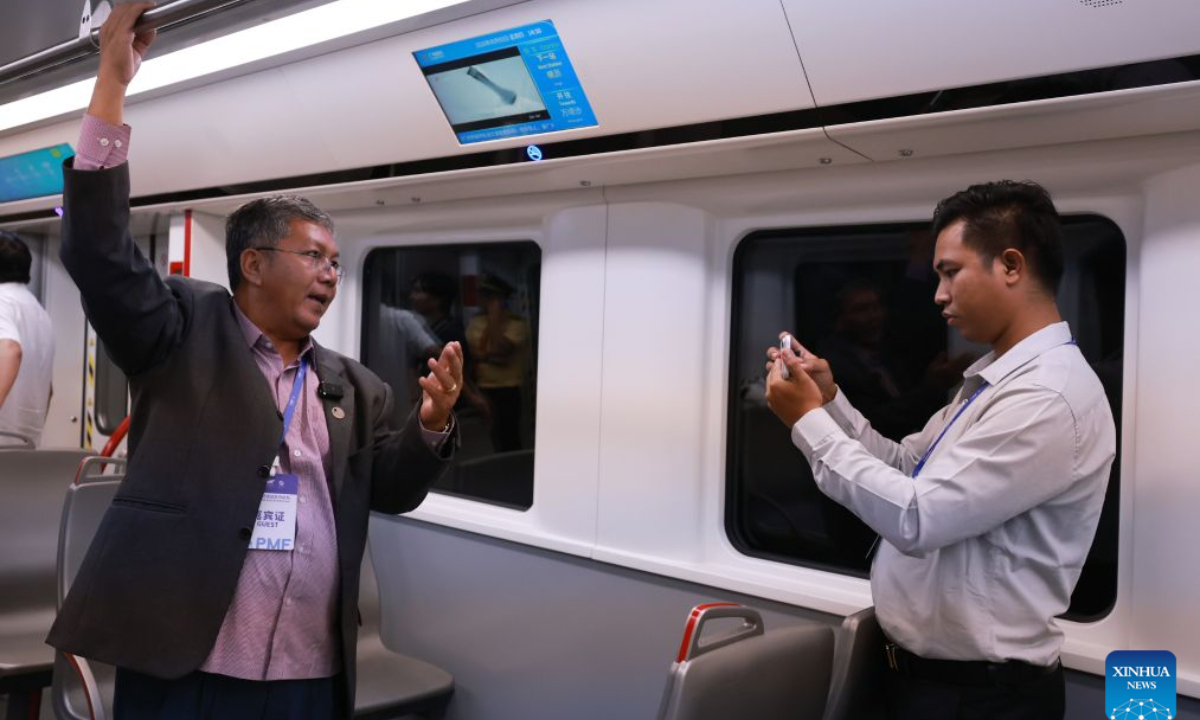 A guest films his passenger experience on Guangzhou Metro Line 18 in Guangzhou, south China's Guangdong Province, Sept. 3, 2026. (Xinhua/Gao Jing)