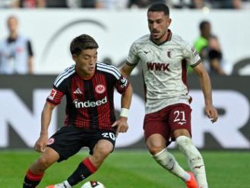 Augsburg reaches Bundesliga top for first time in club history