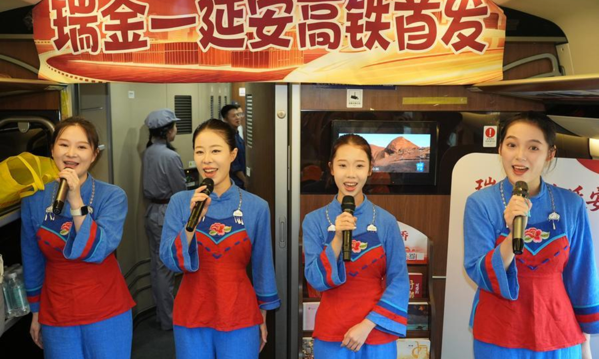 Actresses perform on the first high-speed train from Ruijin in east China's Jiangxi Province to Yan'an in northwest China's Shaanxi Province, Sept. 6, 2026. (Xinhua/Shao Rui)
