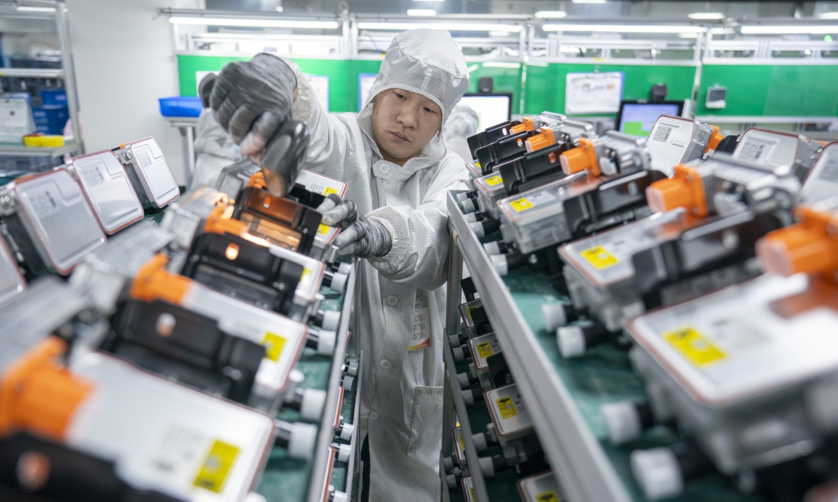 A worker scans and inspects new-energy vehicle PTC heaters ready for delivery at a factory in Xiaogan, Central China's Hubei Province, on February 6, 2026. Photo: VCG
