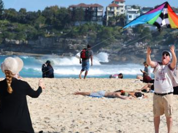 People fly kites during Australia's annual kite festival in Sydney
