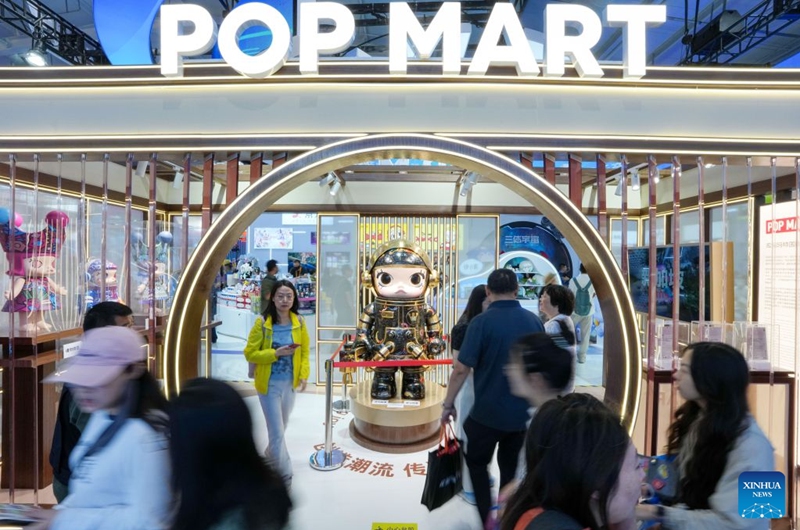 People visit the booth of Pop Mart at the themed exhibition area for culture and tourism services during the 2026 China International Fair for Trade in Services (CIFTIS) at Shougang Park in Beijing, capital of China, Sept. 12, 2026. The 2026 CIFTIS, running from Sept. 9 to 13 at Shougang Park in Beijing, has brought together 413 exhibitors at the themed exhibition area for culture and tourism services, showcasing emerging models of cultural and tourism integration. (Xinhua/Ju Huanzong)