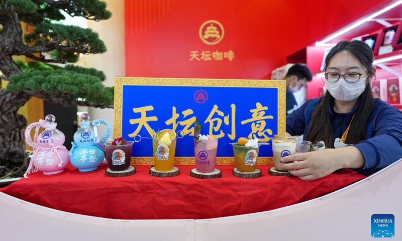 Innovative tea beverages are displayed at the booth of the Temple of Heaven Park at the themed exhibition area for culture and tourism services during the 2026 China International Fair for Trade in Services (CIFTIS) at Shougang Park in Beijing, capital of China, Sept. 12, 2026. The 2026 CIFTIS, running from Sept. 9 to 13 at Shougang Park in Beijing, has brought together 413 exhibitors at the themed exhibition area for culture and tourism services, showcasing emerging models of cultural and tourism integration. (Xinhua/Ju Huanzong)