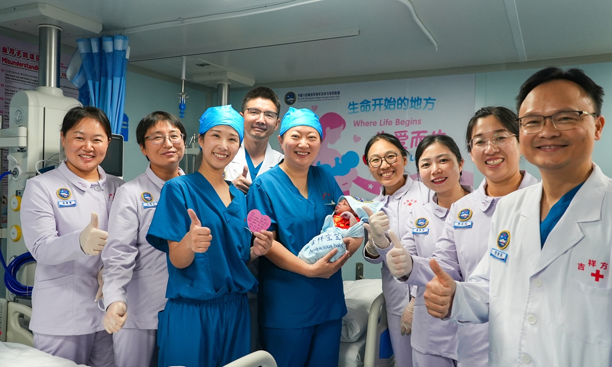 Medical staff pose for a photo with the