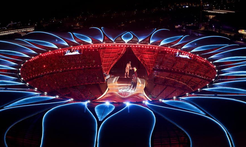 This file photo shows torchbearer Wang Shun and a digital torchbearer jointly lighting the cauldron during the opening ceremony of the 19th Asian Games in Hangzhou, east China's Zhejiang Province, Sept. 23, 2023. (Xinhua/Cheng Tingting)
