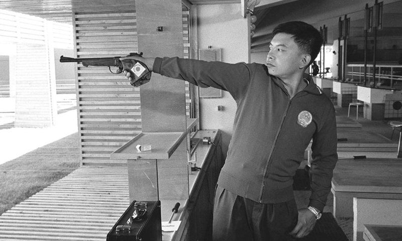 This file photo shows Su Zhibo posing for a photo at the shooting venue of the 7th Asian Games held in Tehran, Iran in 1974. Su won the men's 50-meter pistol event, becoming China's first Asian Games gold medalist. (Xinhua)