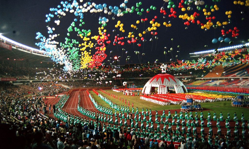 This file photo shows the opening ceremony of the 11th Asian Games in Beijing, Sept. 22, 1990. (Xinhua)
