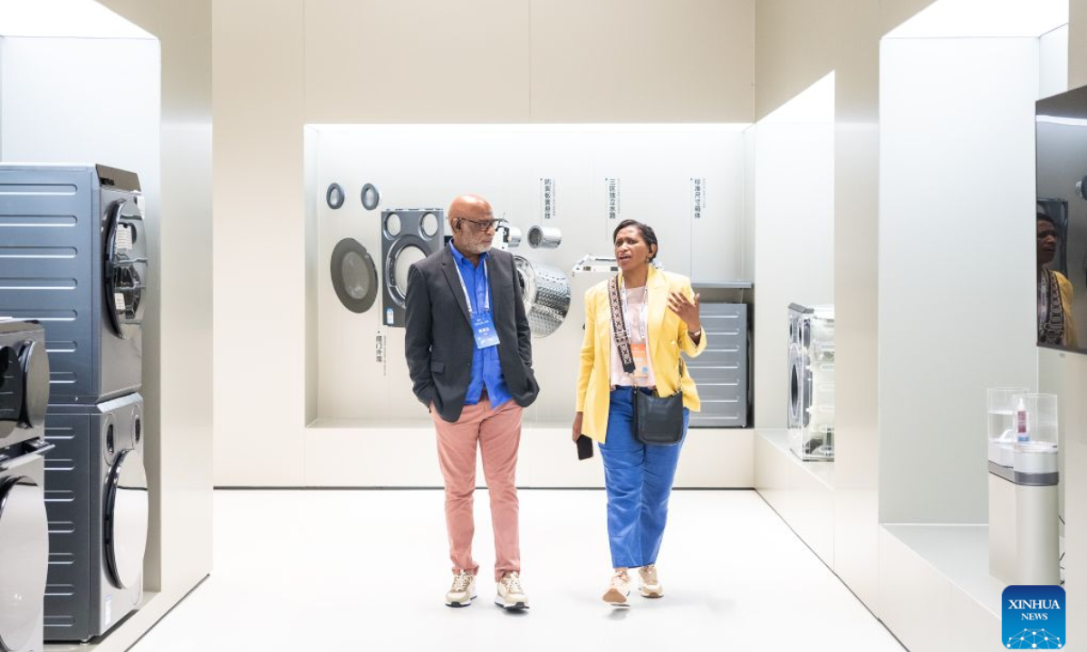Foreign guests visit an exhibition hall at Xiaomi's smart home appliance factory during the 2026 Global Mayors Dialogue - Wuhan in Wuhan, central China's Hubei Province, Sept. 19, 2026. (Photo by Ren Yong/Xinhua)