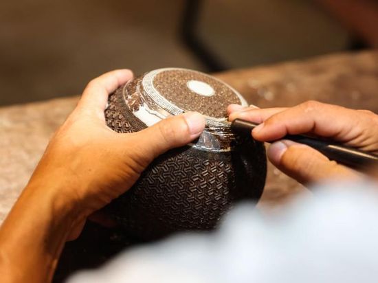 French scholar in pursuit of century-old cultural imprints in coconut carvings