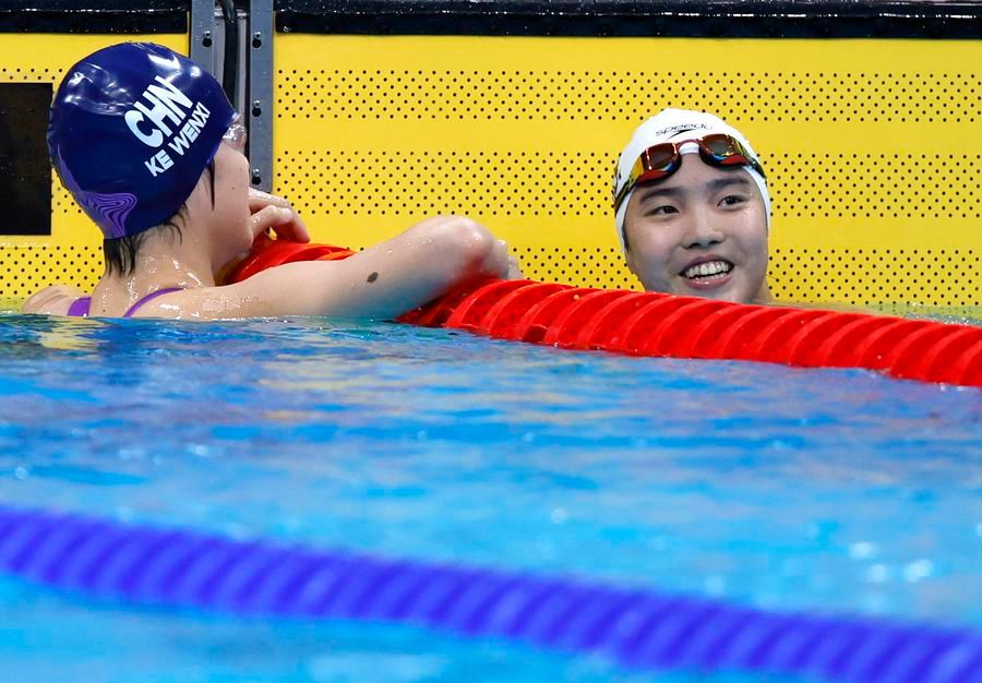 Yu Zidi (R) and Ke Wenxi of China react after the women's 400m individual medley final at the 20th Asian Games Aichi-Nagoya 2026 in Tokyo, Japan, Sept. 23, 2026. (Xinhua/Wu Zhizun)