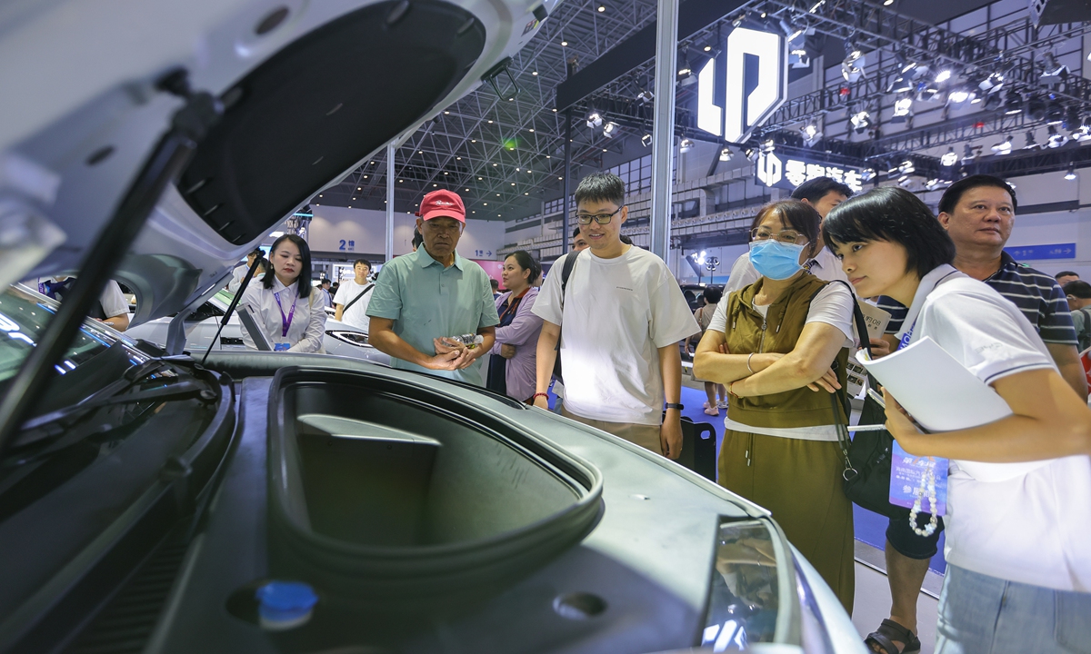 Visitors check out the front trunk of a new energy vehicle at the 2026 Hainan International Auto Expo and the 8th Hainan International New Energy Vehicle Exhibition in Haikou, South China’s Hainan Province, on July 9, 2026. Photo: VCG