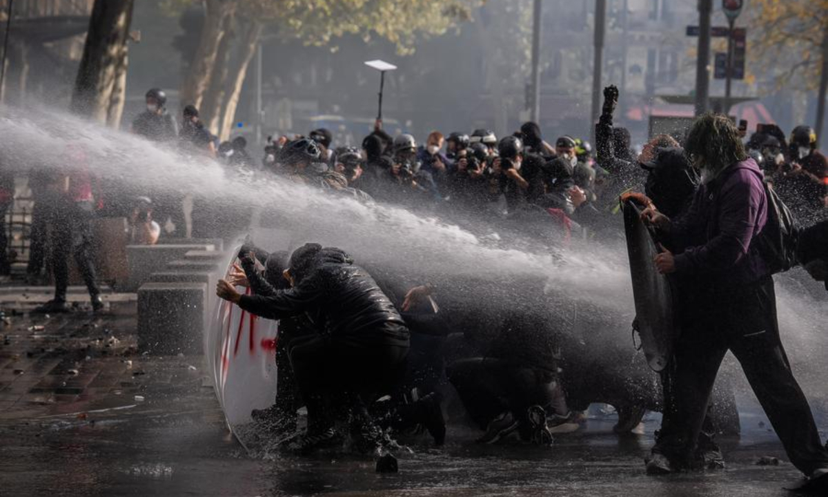 Demonstrators face off with law enforcement officers during a protest in Paris, France, Oct. 17, 2026. (Photo by Aurelien Morissard/Xinhua)