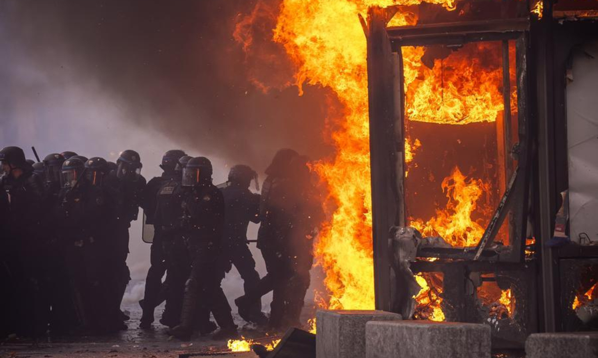 Law enforcement officers are seen during a protest in Paris, France, Oct. 17, 2026. French Interior Minister Laurent Nunez said Saturday that about 550,000 people took part in the protests across France. (Photo by Aurelien Morissard/Xinhua)