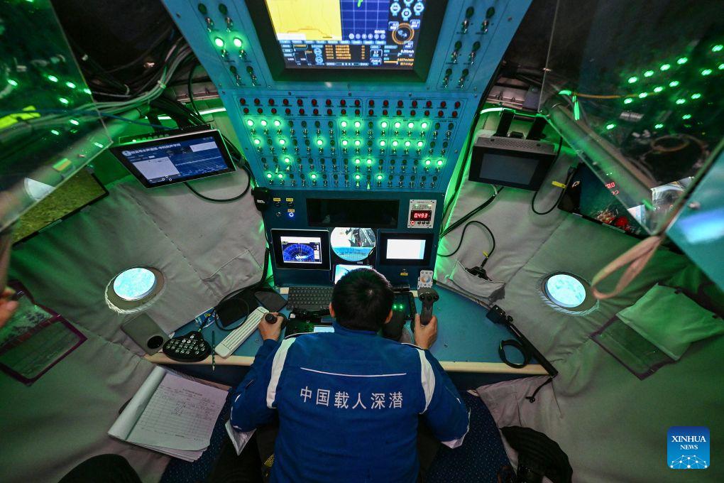 Submersible pilot Tang Jialing operates the manned deep-sea submersible Jiaolong on Oct. 15, 2026. China's research vessel Deep Sea No. 1, carrying manned deep-sea submersible Jiaolong, is currently on the western Pacific Ocean for deep-sea scientific research.Jiaolong successfully completed its 470th dive on Oct. 15.A Xinhua reporter aboard Jiaolong photographed the exploration of the mysterious underwater world. (Xinhua/Li Xin)