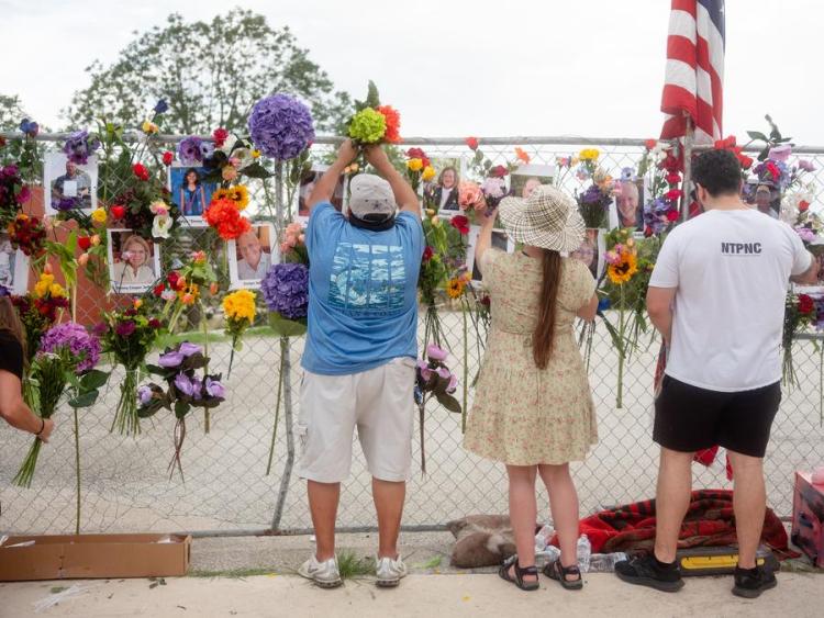 Trump visits Texas flooded area, dismissing criticism on alerts