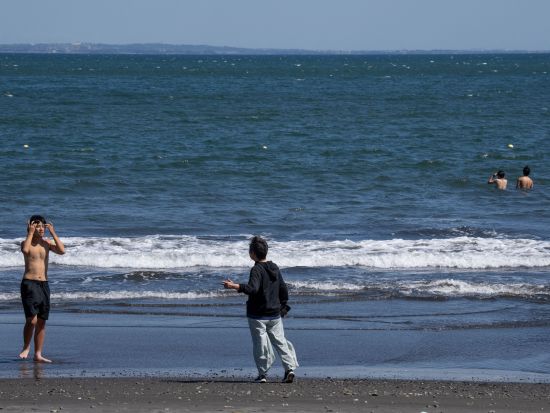 Japan downgrades tsunami warnings, advisories remain