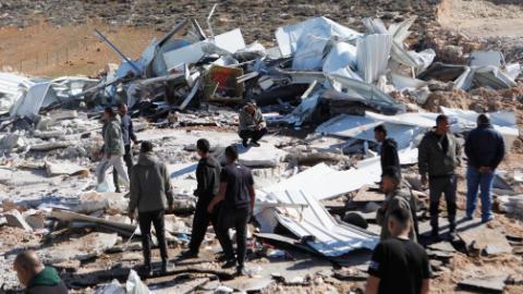 Israeli military bulldozers demolish shops in West Bank