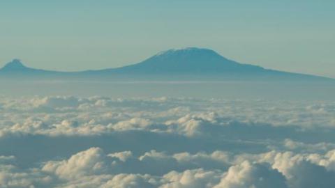 View of Mount Kilimanjaro through airplane window