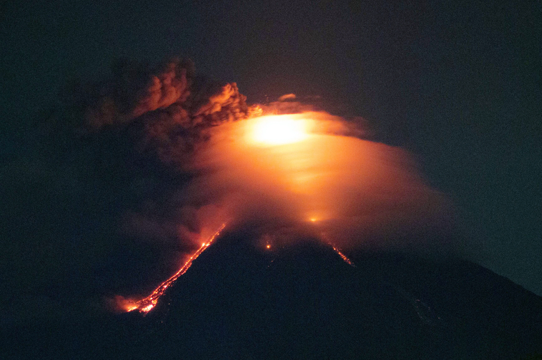 Lava cascades down the slopes of Mayon volcano as seen from Legazpi city, Albay province, around 340 kilometers (210 miles) southeast of Manila, Philippines, Monday, Jan. 15, 2018. More than 9,000 people have evacuated the area around the Philippines’ most active volcano as lava flowed down its crater Monday in a gentle eruption that scientists warned could turn explosive. (AP Photo/Earl Recamunda)